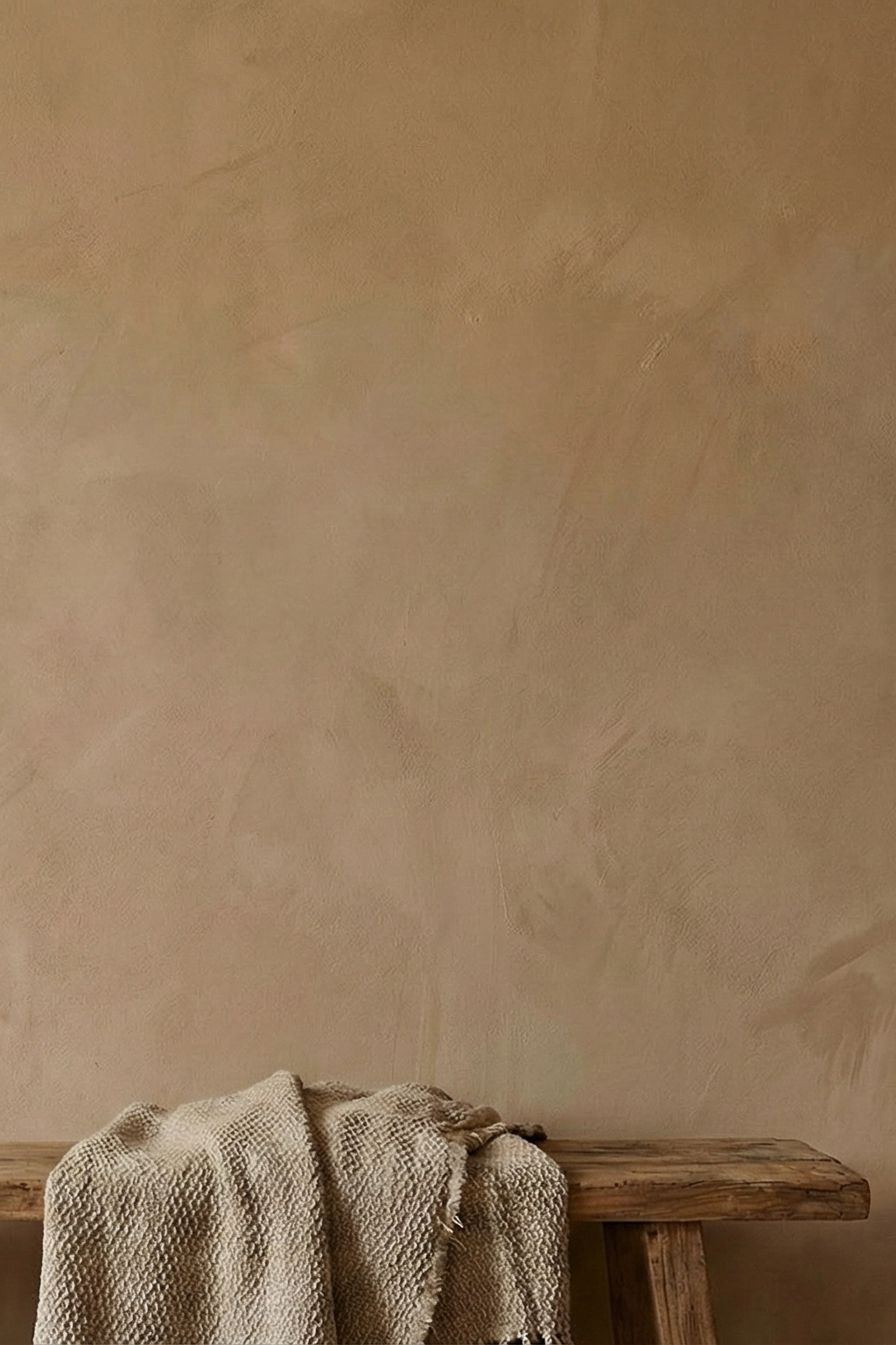 Beige limewash paint by Limewash.com, neutral limewash for interior or exterior walls, textured surface detail.