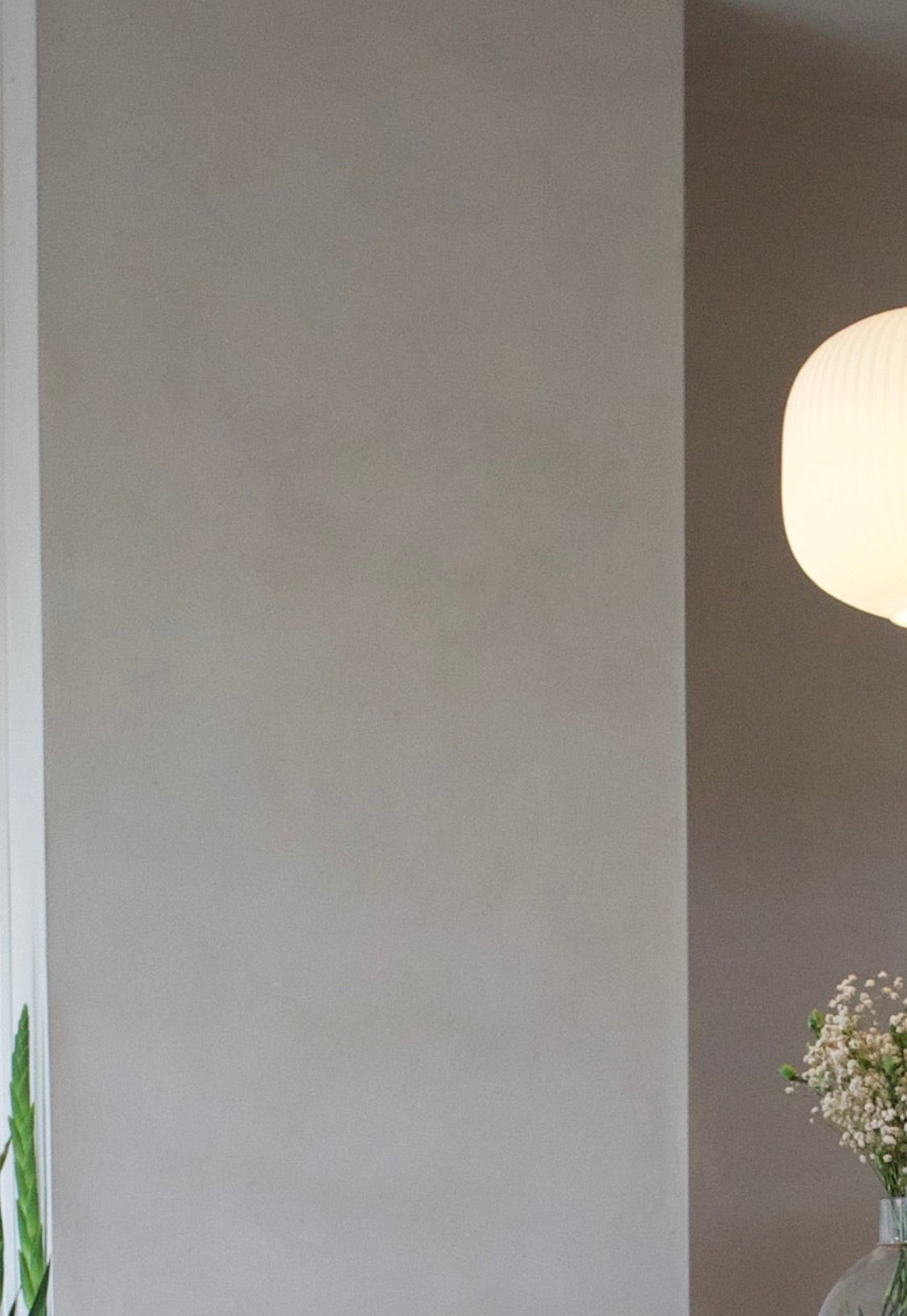 Beige limewash paint with moonstone finish, shown in a smooth textured wall application from Limewash.com