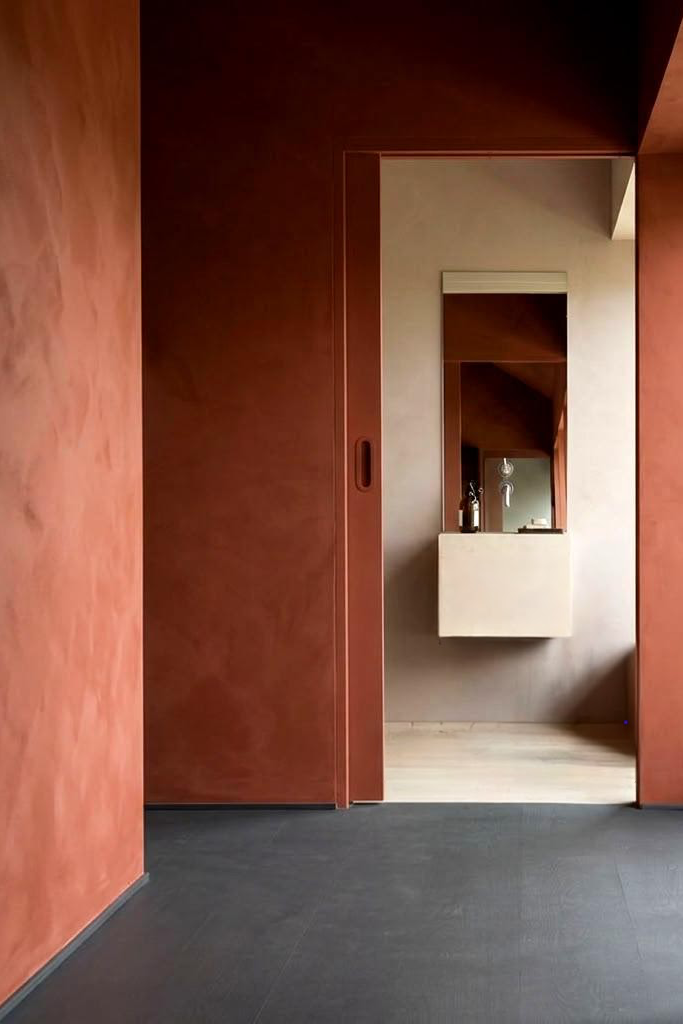 Muted cherry red limewash colour 